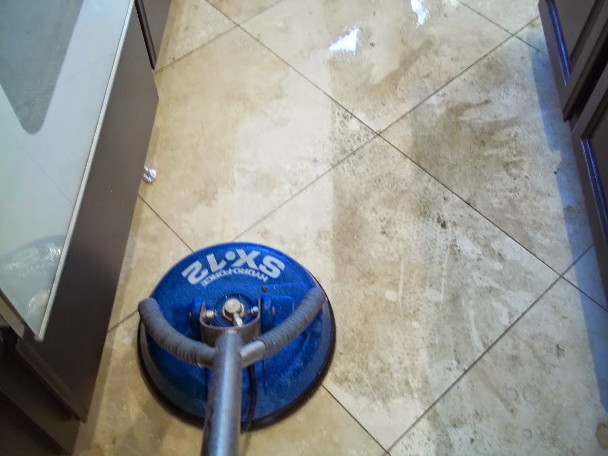 Dunn-Rite Carpet Care tile cleaning machine on a travertine floor